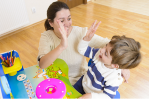 woman-and-boy-high-five-300x200.png