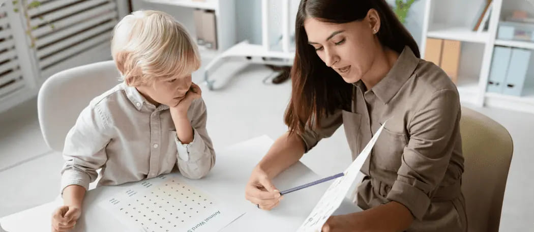 Woman-doing-speech-therapy-with-little-blonde-boy-1.jpg