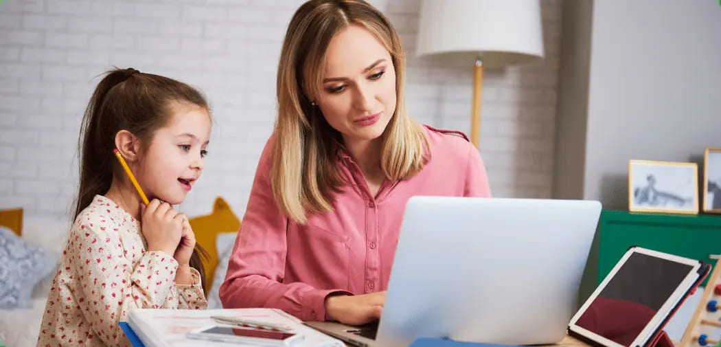 Young-mother-working-from-home-with-daughter-1.jpg