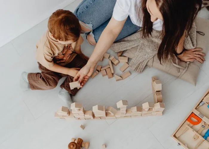 Parent and child playing a game together