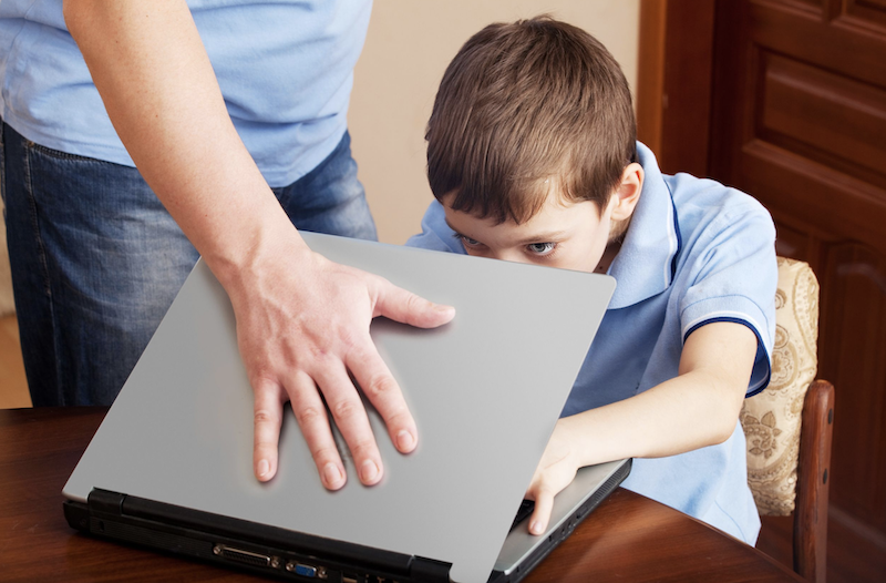 Addicted-screen-Kid-on-laptop-father-closing-it.png